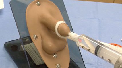 Demonstration of method of injecting rug contrast into male urethra